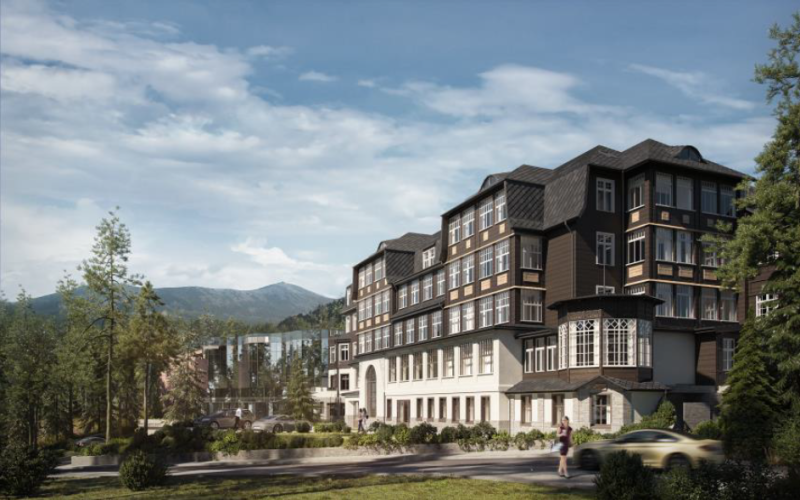 Widok na duży, luksusowy hotel na tle gór